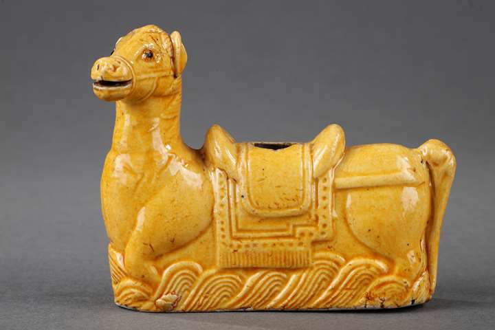 Chinese yellow enamelled biscuit water dropper in the shapeof a horse